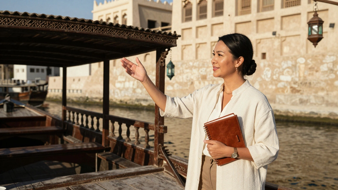 A Filipina woman beside a traditional dhow boat on Dubai Creek, pointing toward historic architecture.